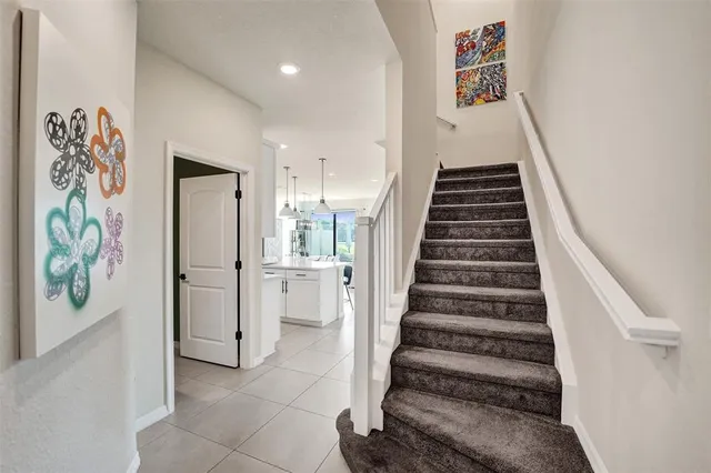 a bathroom with a granite countertop sink mirror vanity and toilet