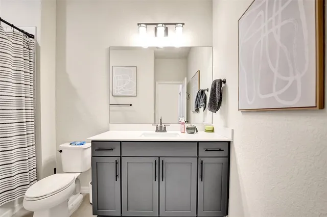 a view of a lake with a table and chairs