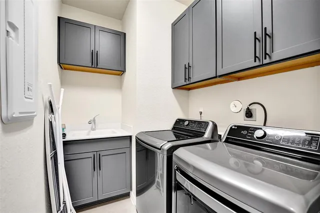 a front view of a house with plants