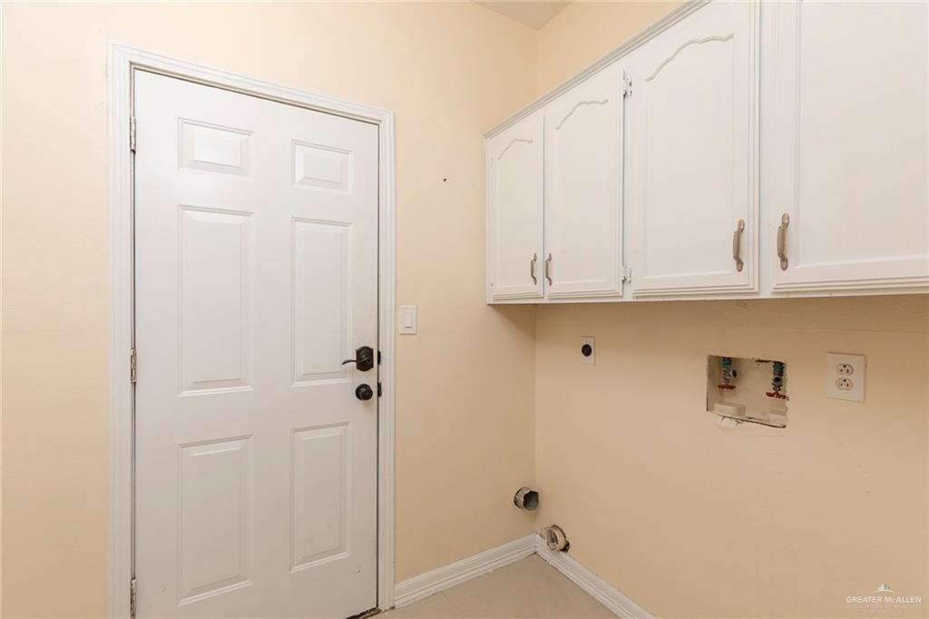 2001 Quail Lane Mission, TX 78572 - Photo 22 of 28 Utility room with light-colored walls and white baseboards
