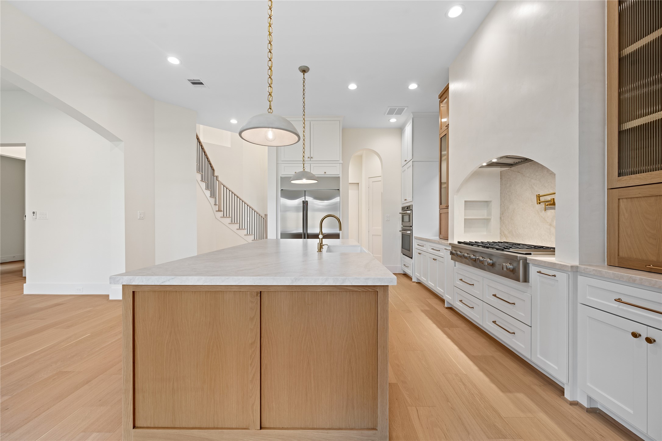 1441 Chamboard Lane Houston, TX 77018 - Photo 11 of 46 a large kitchen with granite countertop a sink a stove and a refrigerator
