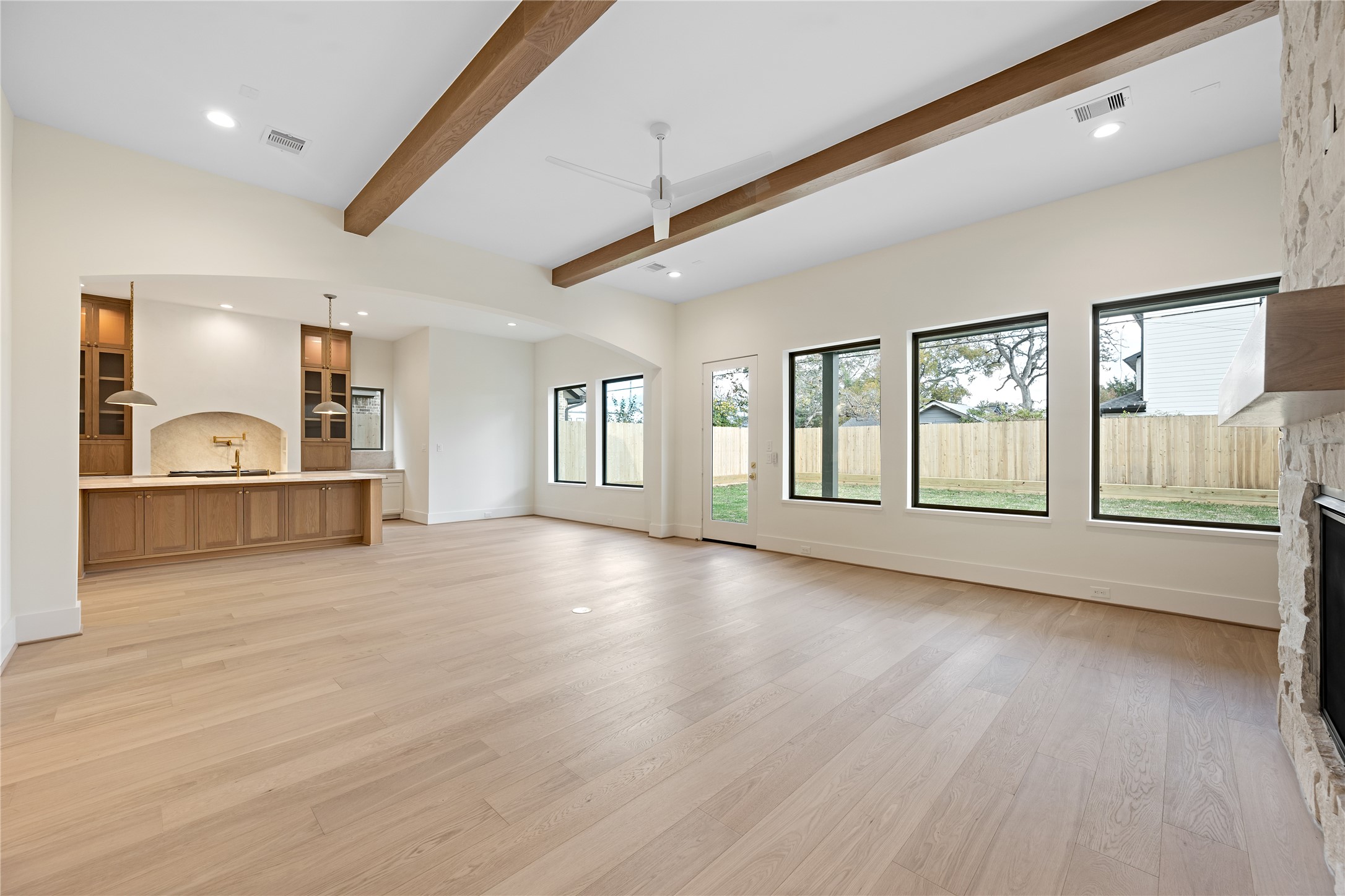 1441 Chamboard Lane Houston, TX 77018 - Photo 17 of 46 a view of an empty room with a window and wooden floor