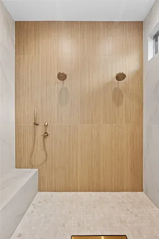 a white bath tub sitting in a bathroom