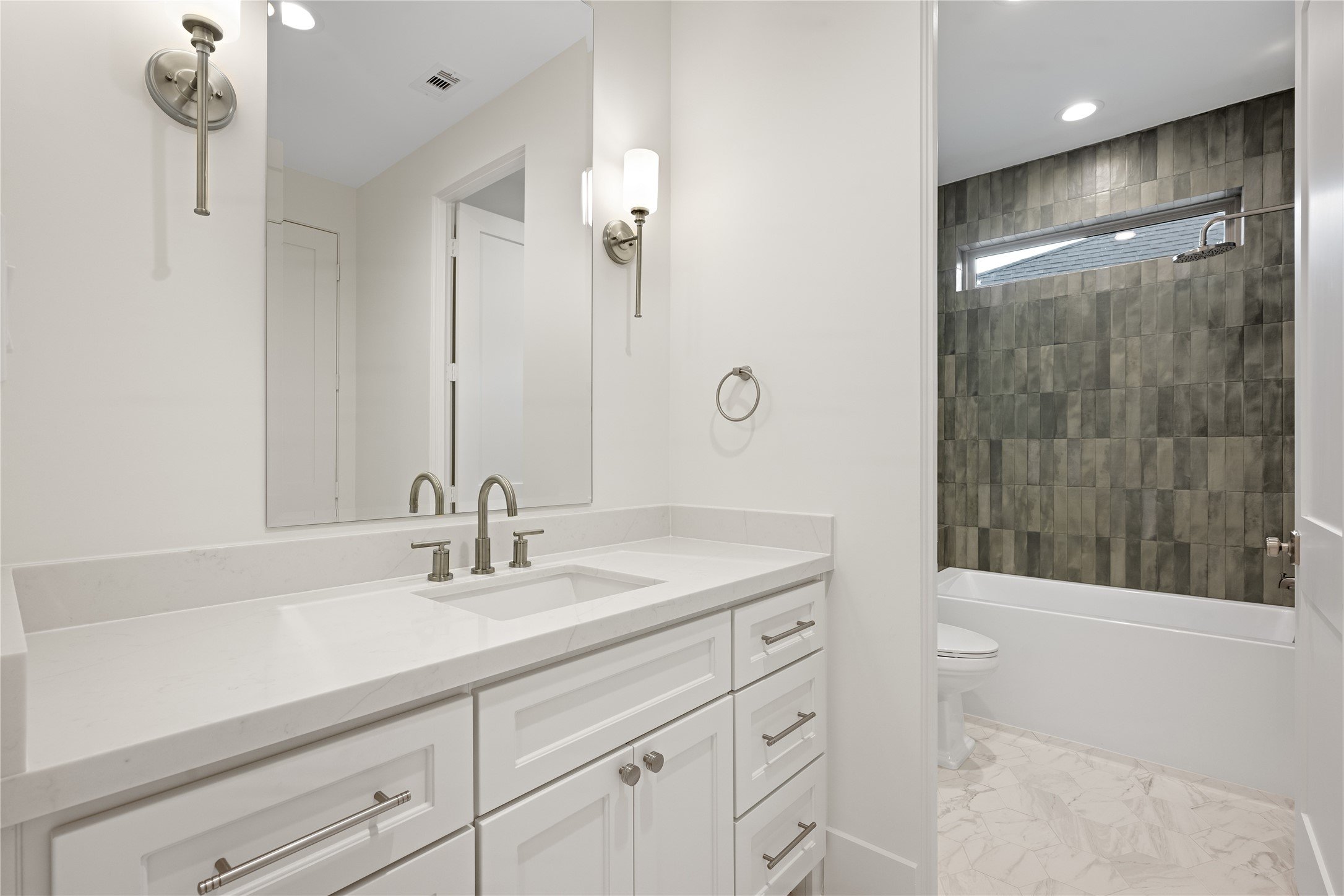 1441 Chamboard Lane Houston, TX 77018 - Photo 29 of 46 a bathroom with a sink a shower and a mirror
