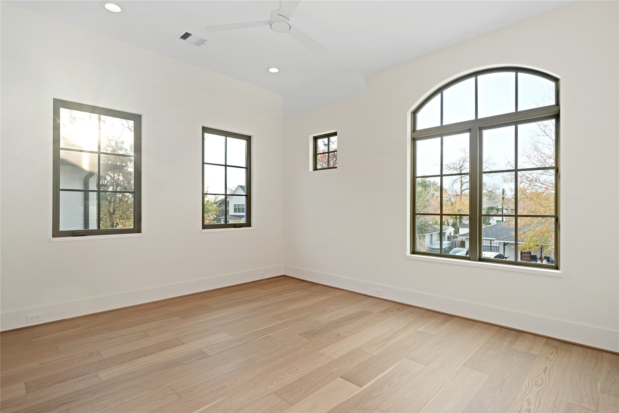 1441 Chamboard Lane Houston, TX 77018 - Photo 30 of 46 an empty room with wooden floor and windows