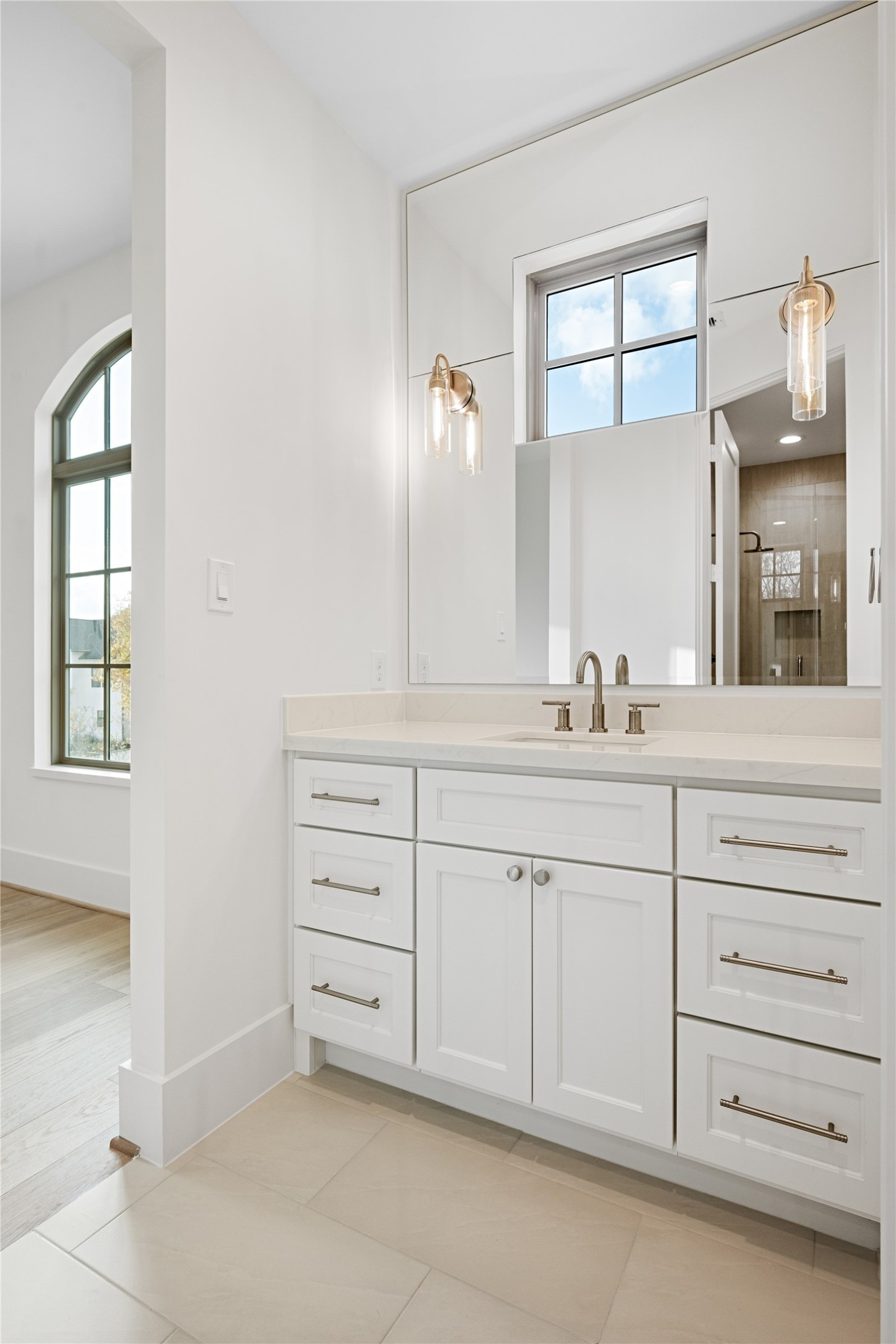 1441 Chamboard Lane Houston, TX 77018 - Photo 32 of 46 a bathroom with a sink vanity and mirror