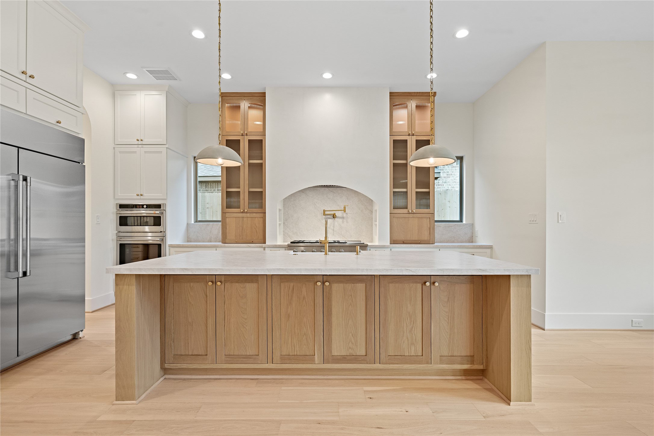 1441 Chamboard Lane Houston, TX 77018 - Photo 7 of 46 a large kitchen with granite countertop a large counter top space stainless steel appliances and cabinets