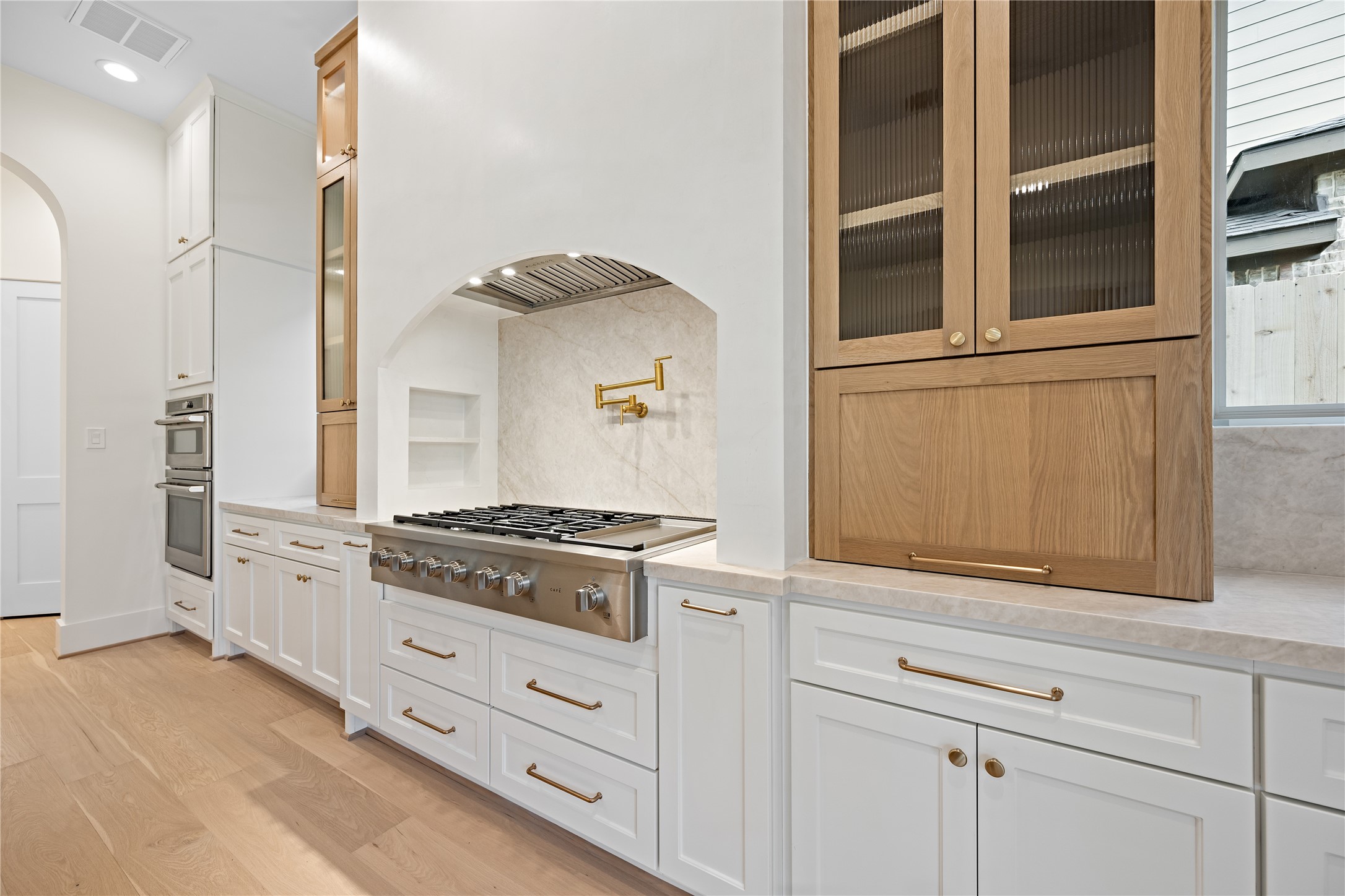 1441 Chamboard Lane Houston, TX 77018 - Photo 10 of 46 a kitchen with stainless steel appliances white cabinets and a stove
