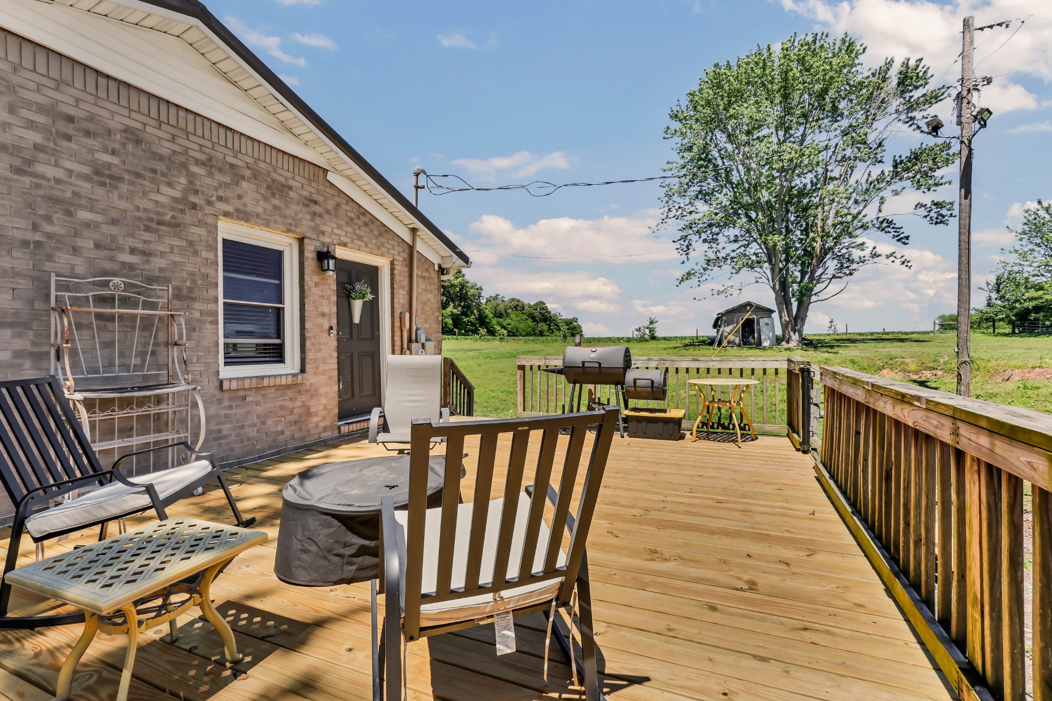 1068 Hugh Hunter Road Oak Grove, KY 42262 - Photo 22 of 30 a view of a patio with couches chairs and wooden floor