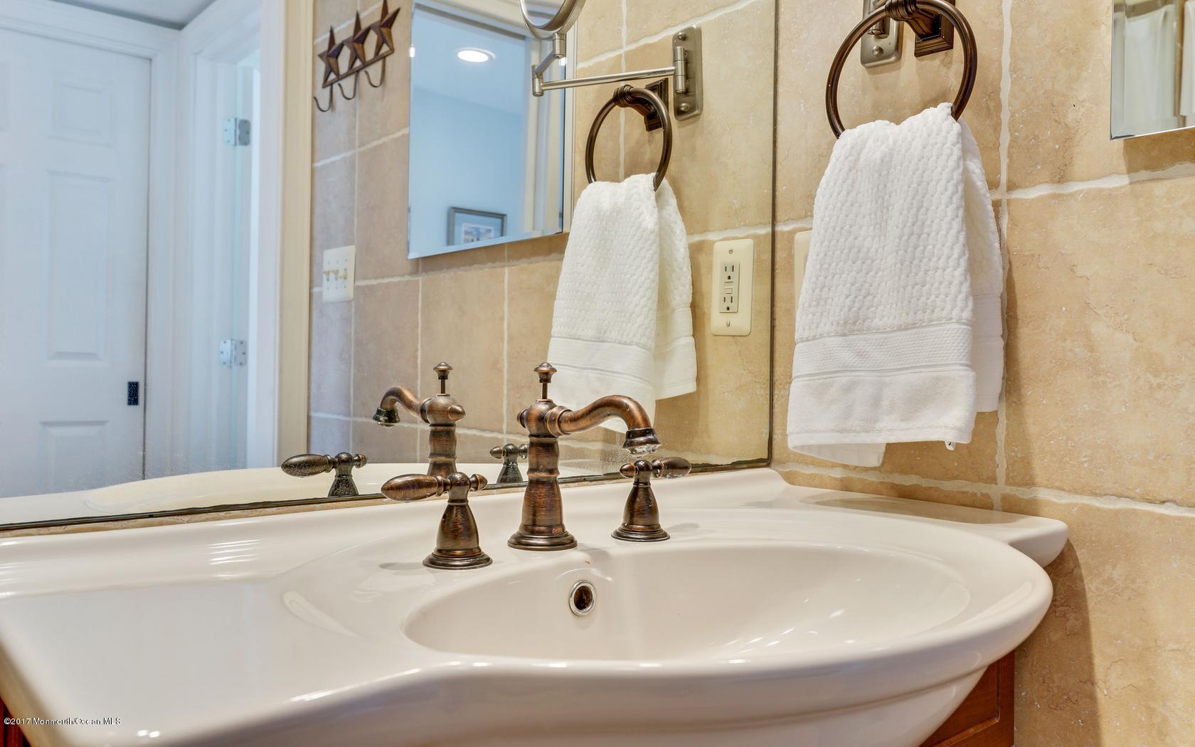 200 Portland Road, Unit B5 Highlands, NJ 07732 - Photo 16 of 25 a bathroom with a sink and a mirror