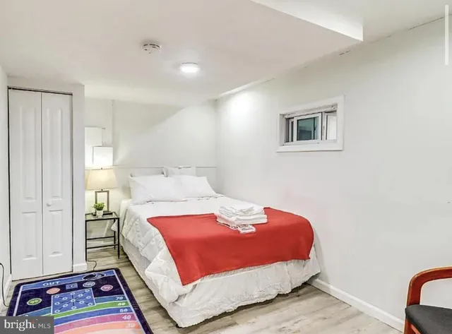 a bedroom with a bed and a couch