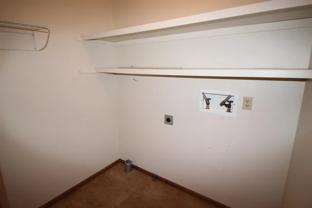 a view of a porch with wooden floor and wooden fence