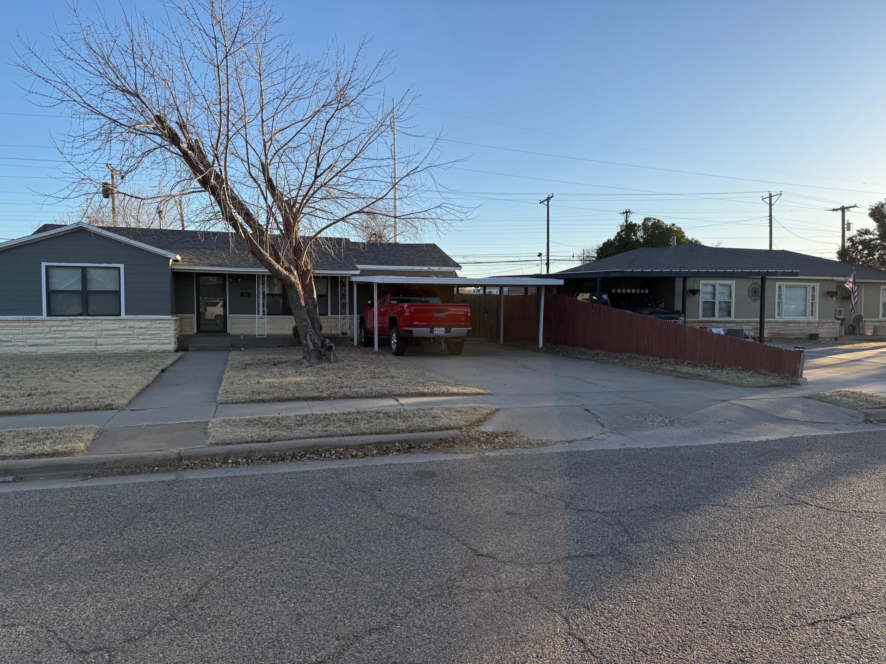 4117 33rd Street Lubbock, TX 79410 - Photo 3 of 14 a view of a house with a yard
