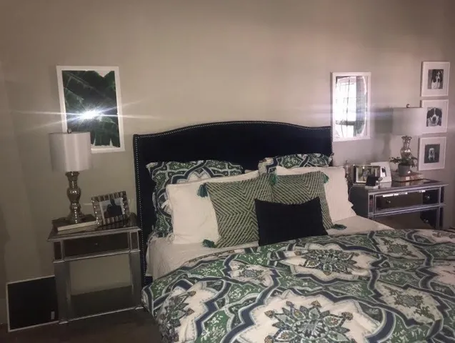 a bedroom with a bed and a dresser