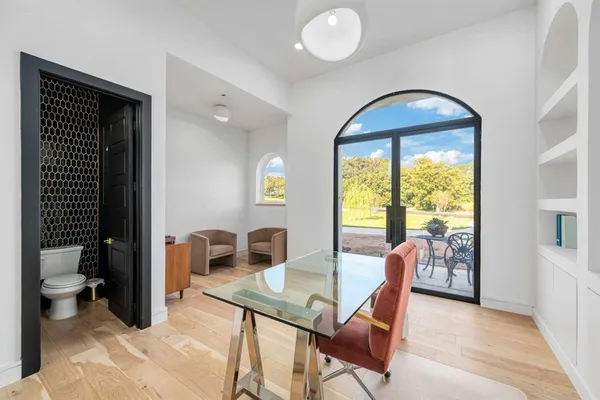 a view of a livingroom with furniture and front door