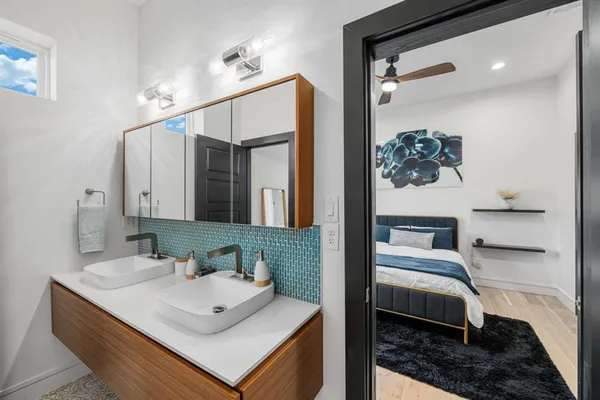 a bathroom with a sink and a mirror
