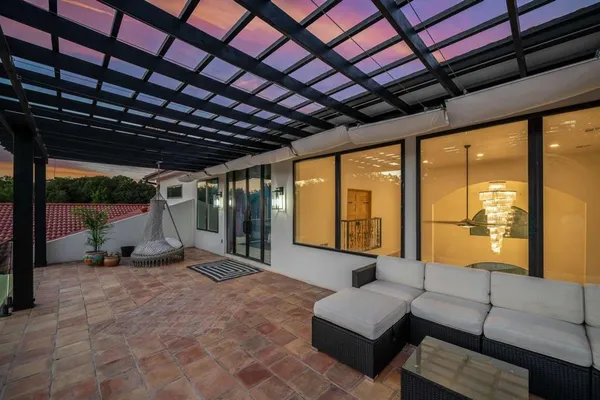 a view of backyard with outdoor seating and green space