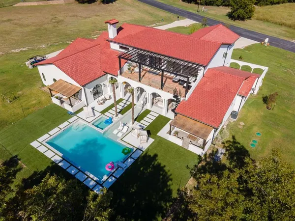 an aerial view of a house with a garden