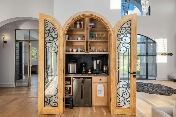 a view of an entryway with wooden floor