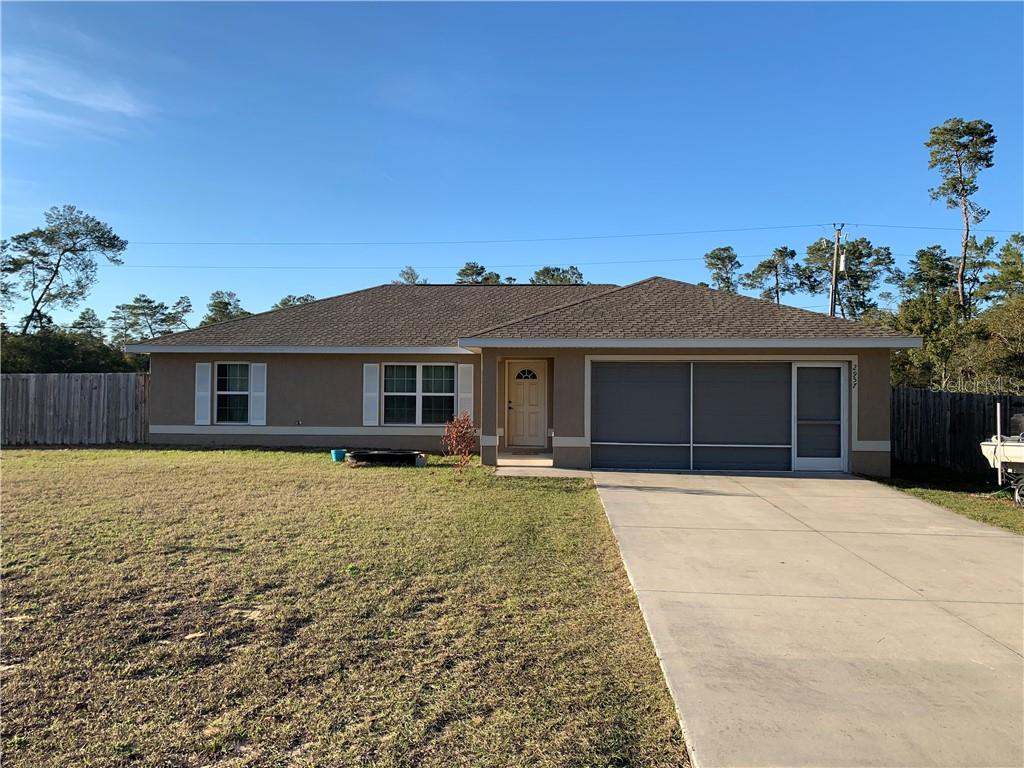 2957 Southwest 172nd Lane Road Ocala, FL 34473 - Photo 1 of 1 front view of a house with a yard