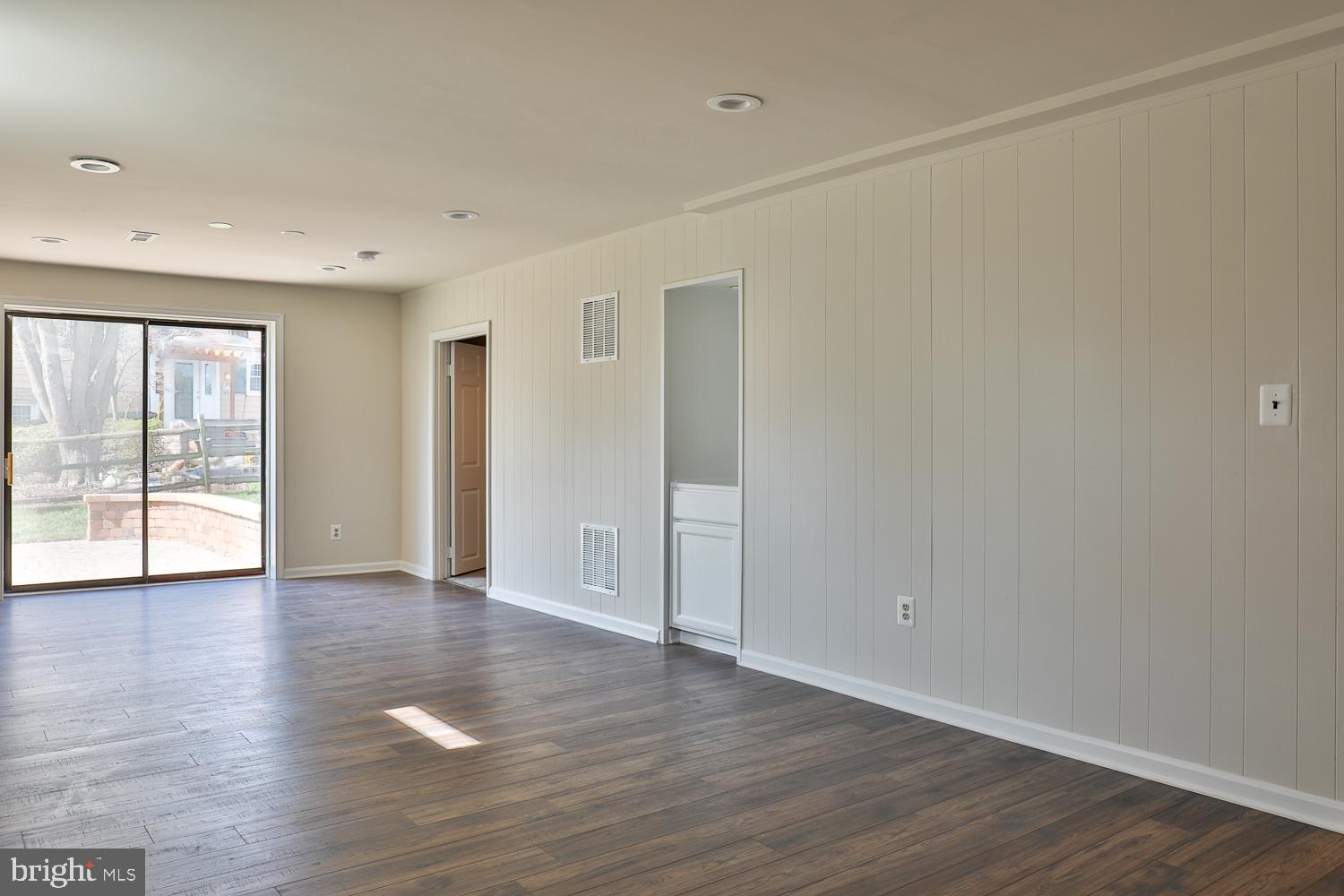 5423 Rilian Court Burke, VA 22015 - Photo 63 of 67 an empty room with wooden floor and windows