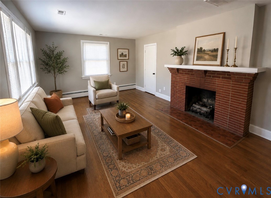 5310 Raleigh Road Henrico, VA 23231 - Photo 5 of 20 a living room with furniture and a fireplace