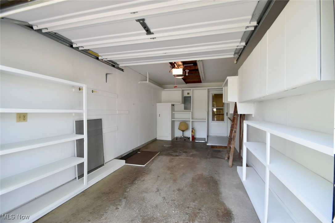 8955 West Ridge Road, Unit D Elyria, OH 44035 - Photo 33 of 33 Garage featuring a garage door opener