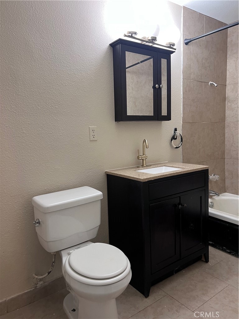25346 Agate Road Barstow, CA 92311 - Photo 10 of 10 a bathroom with a toilet sink and mirror