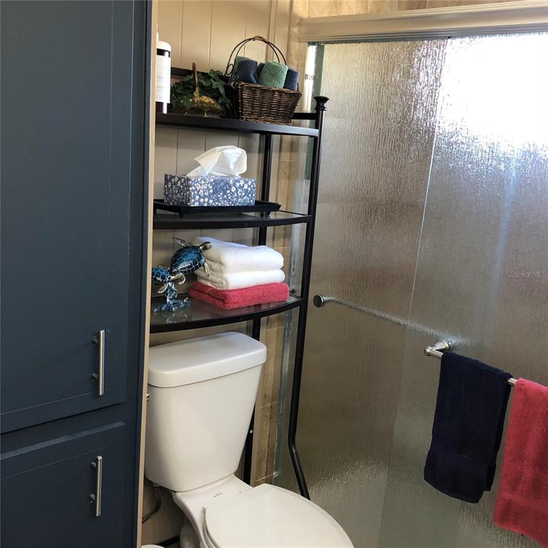 24437 Harbor View Road, Unit 12 Port Charlotte, FL 33980 - Photo 13 of 36 a bathroom with a toilet and a sink