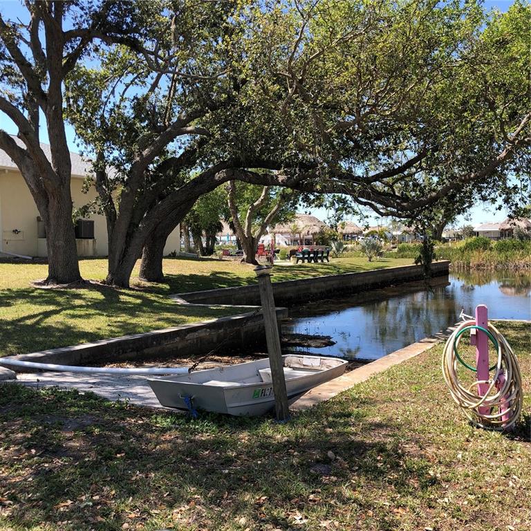 24437 Harbor View Road, Unit 12 Port Charlotte, FL 33980 - Photo 27 of 36 a view of a lake with a fountain