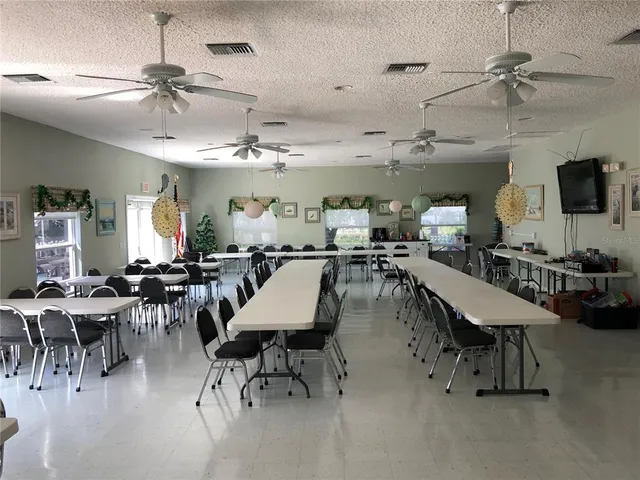 a room with lots of furniture and a chandelier