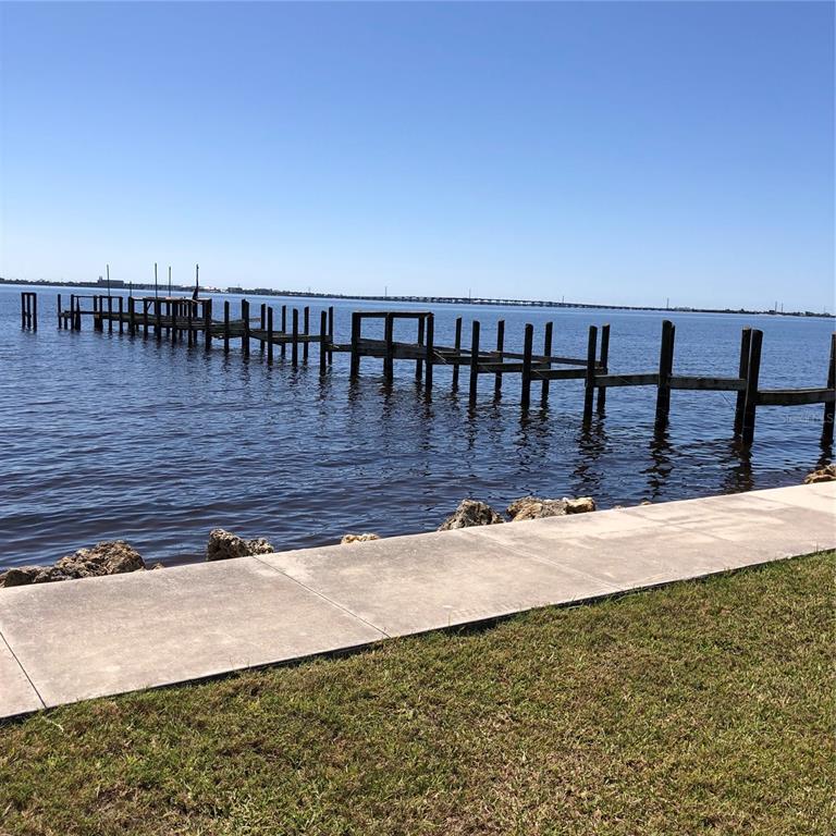 24437 Harbor View Road, Unit 12 Port Charlotte, FL 33980 - Photo 35 of 36 a view of a backyard of a house