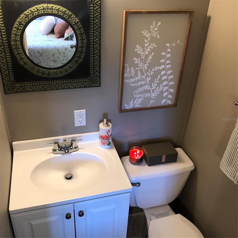 24437 Harbor View Road, Unit 12 Port Charlotte, FL 33980 - Photo 9 of 36 a bathroom with a toilet and sink