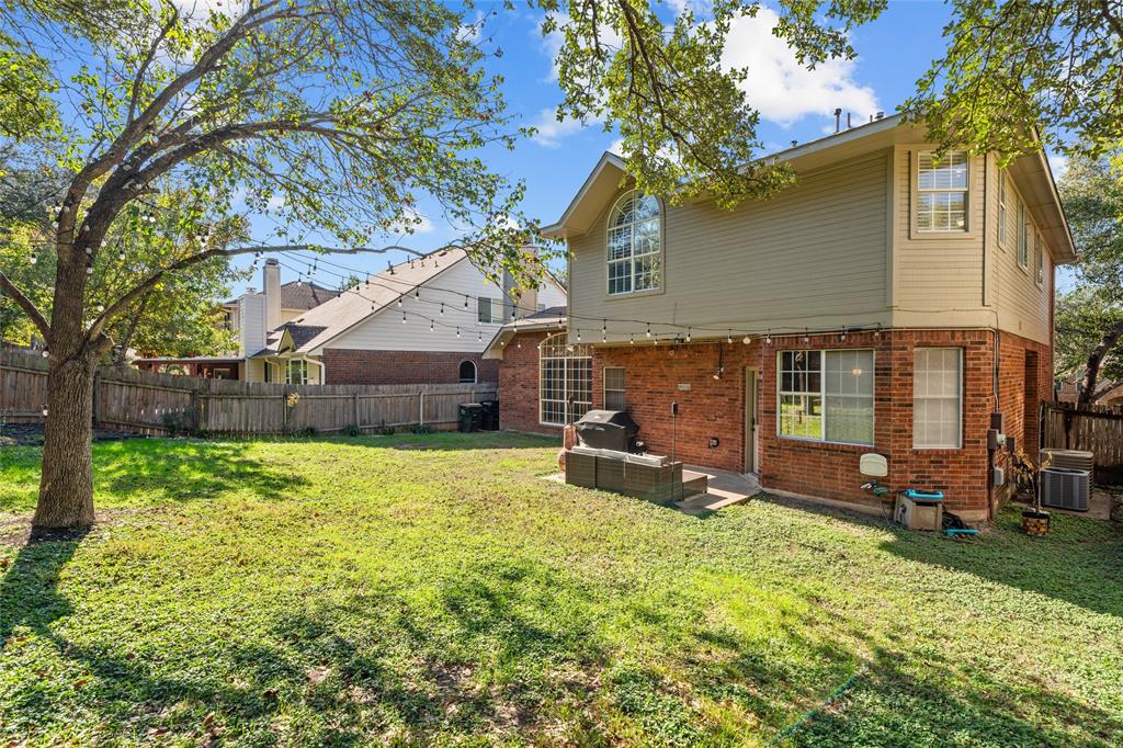 3901 Caney Creek Road Austin, TX 78732 - Photo 17 of 18 Spacious fenced back yard with outdoor lighting