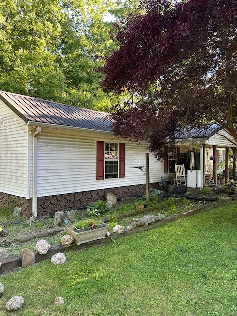 698 Clearview Road Cottontown, TN 37048 - Photo 1 of 23 a backyard of a house with potted plants and large tree