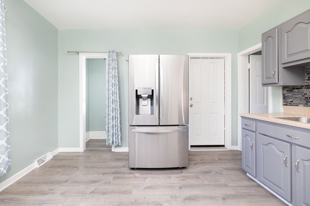 60 Roy Street Chicopee, MA 01013 - Photo 14 of 39 a kitchen with stainless steel appliances a refrigerator and cabinets