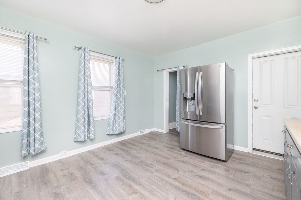 60 Roy Street Chicopee, MA 01013 - Photo 15 of 39 a view of kitchen with wooden floor electronic appliances and furniture