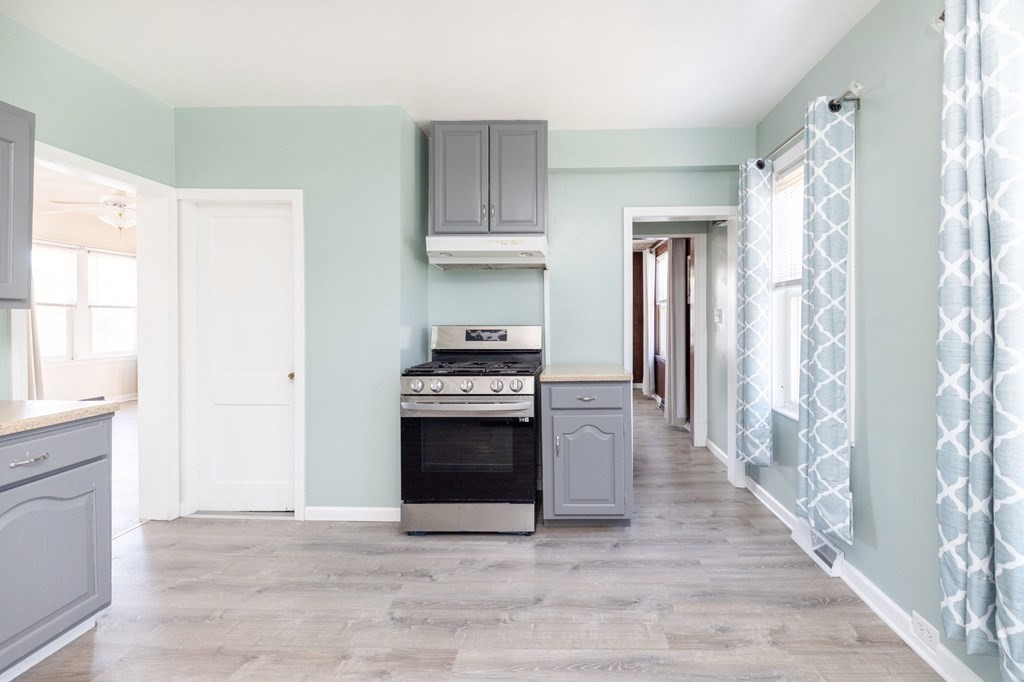 60 Roy Street Chicopee, MA 01013 - Photo 17 of 39 a kitchen with stainless steel appliances a stove and a refrigerator