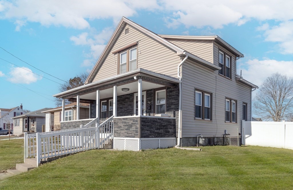 60 Roy Street Chicopee, MA 01013 - Photo 2 of 39 a front view of a house with a yard