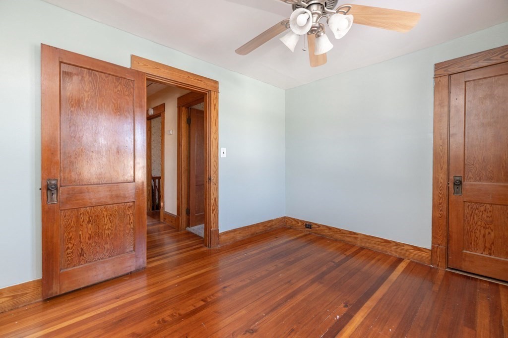 60 Roy Street Chicopee, MA 01013 - Photo 23 of 39 an empty room with wooden floor closet and windows