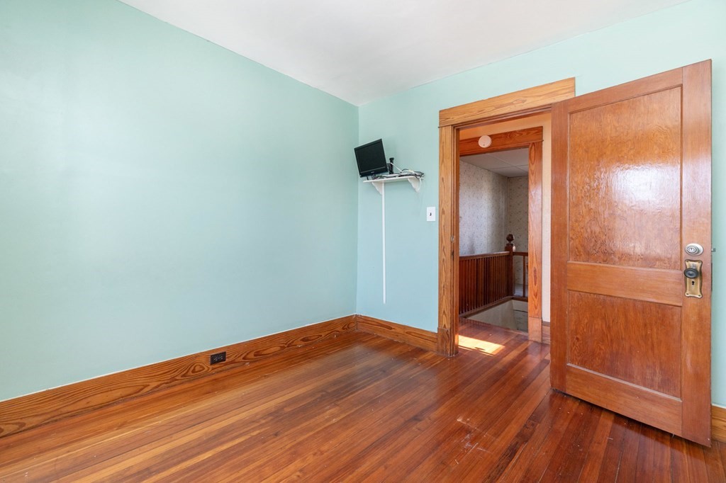 60 Roy Street Chicopee, MA 01013 - Photo 26 of 39 wooden floor in an empty room