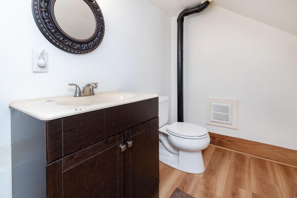 60 Roy Street Chicopee, MA 01013 - Photo 28 of 39 a bathroom with a sink a toilet and a mirror
