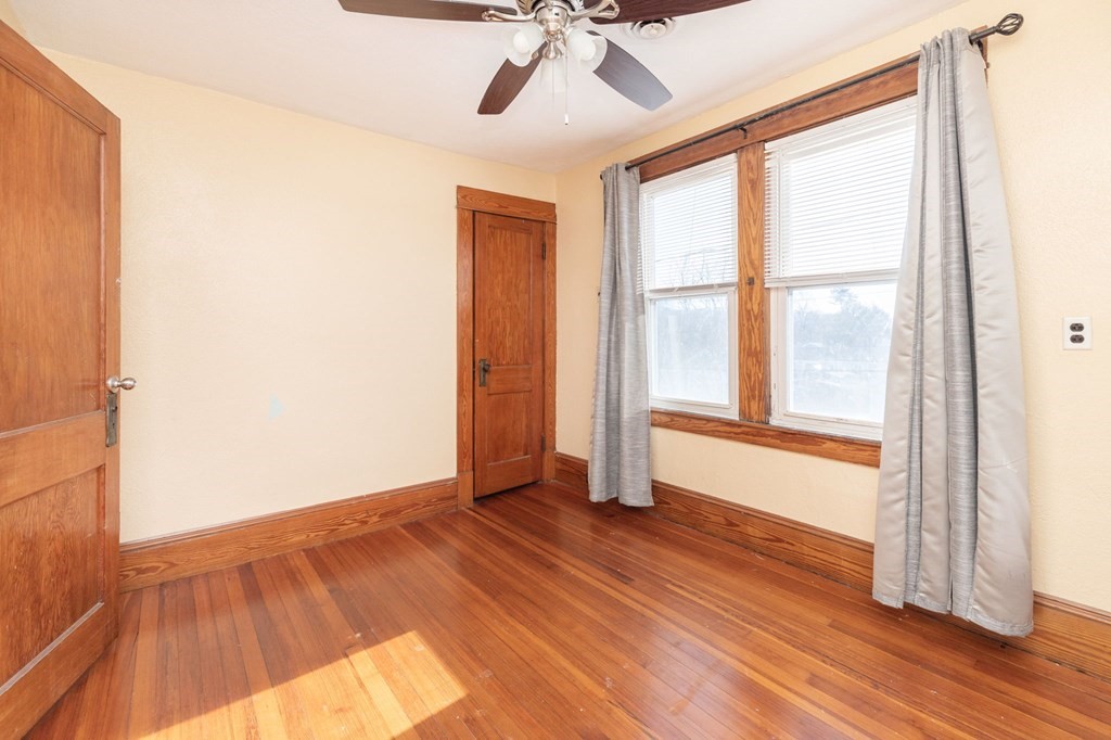 60 Roy Street Chicopee, MA 01013 - Photo 32 of 39 a view of an empty room with wooden floor and a window