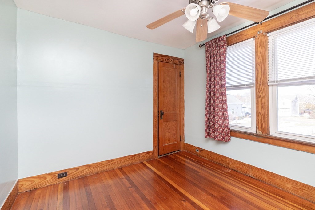 60 Roy Street Chicopee, MA 01013 - Photo 33 of 39 a view of empty room with wooden floor and fan