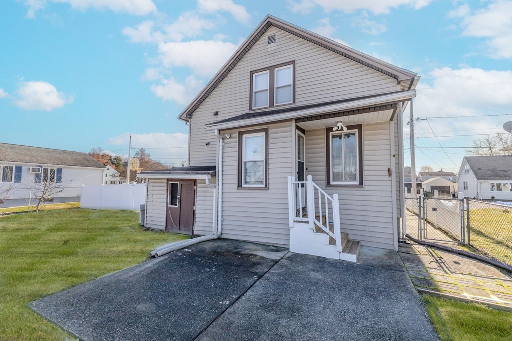 60 Roy Street Chicopee, MA 01013 - Photo 35 of 39 a front view of a house with a yard