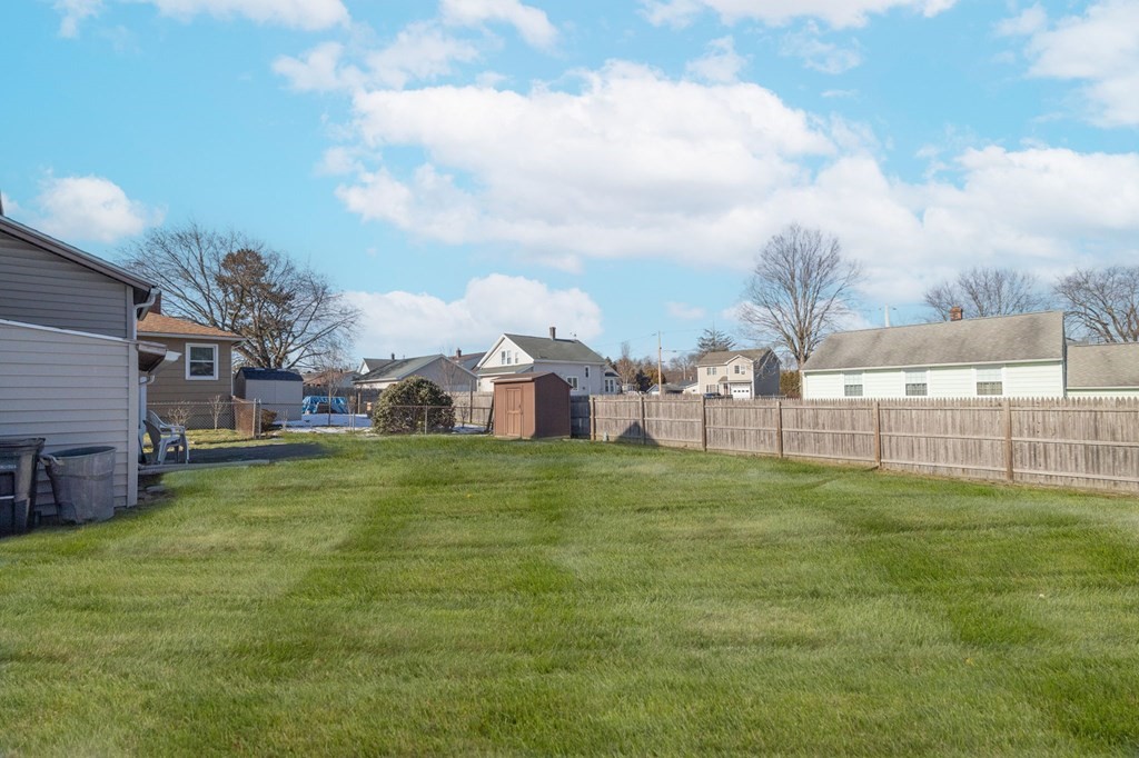 60 Roy Street Chicopee, MA 01013 - Photo 39 of 39 a house with huge green field in front of it