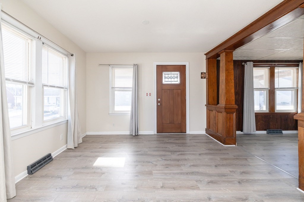 60 Roy Street Chicopee, MA 01013 - Photo 7 of 39 an empty room with wooden floor and windows