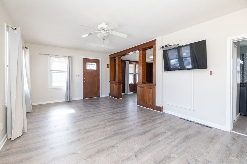 60 Roy Street Chicopee, MA 01013 - Photo 8 of 39 an empty room with wooden floor and windows