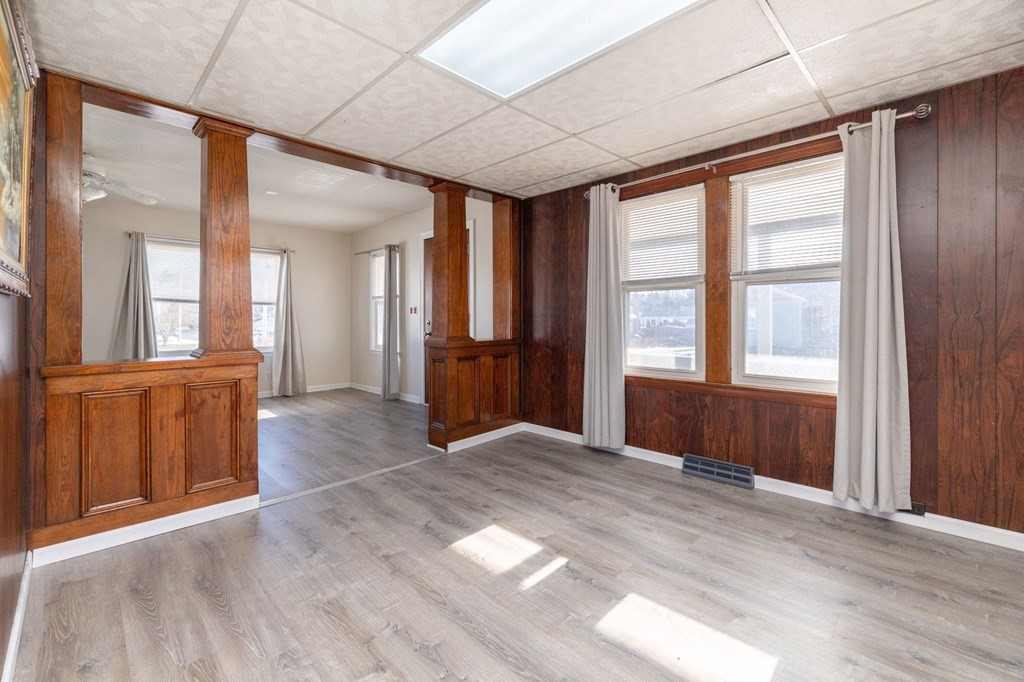 60 Roy Street Chicopee, MA 01013 - Photo 9 of 39 a view of an empty room with wooden floor and a window