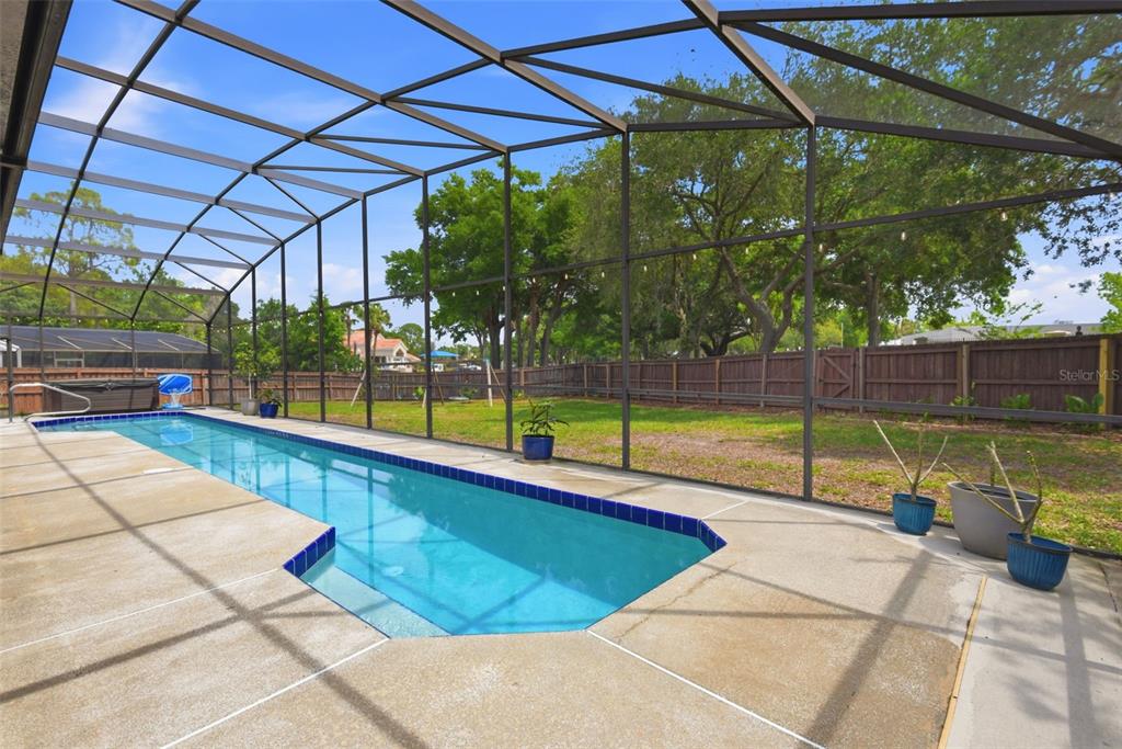 7432 Sparkling Lake Road Orlando, FL 32819 - Photo 33 of 54 a view of a backyard with swimming pool
